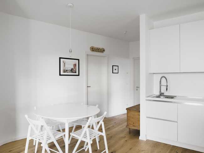 The kitchen opens towards the hall and the corridor