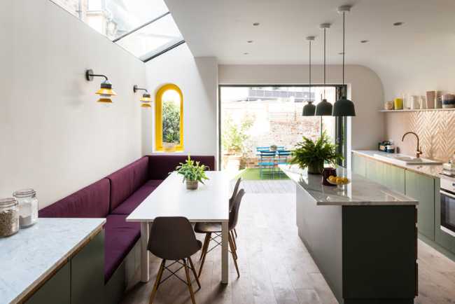 Dining area and kitchen area with pastel colors