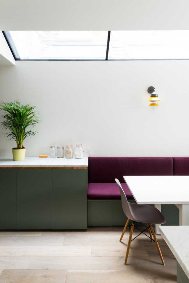 Dining area and kitchen area with pastel colors