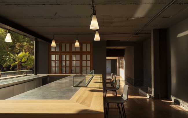 The rectangular table facing the garden