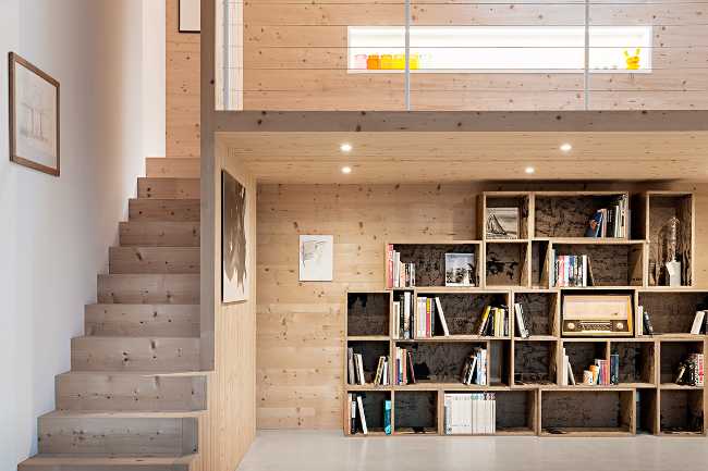 Wooden interior with staircase and bookcase