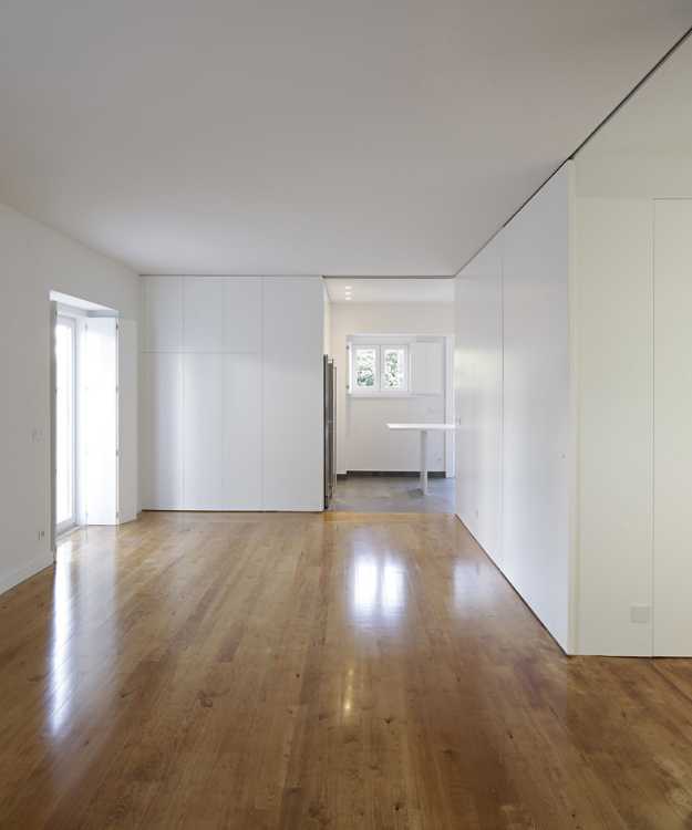 Full height white furniture creates retractable containers