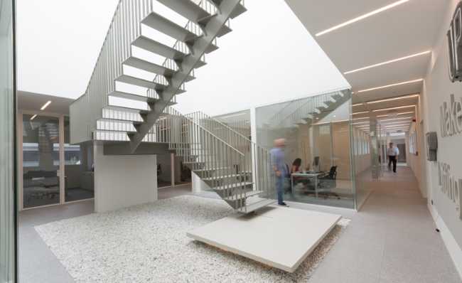 Internal stairs between metal offices