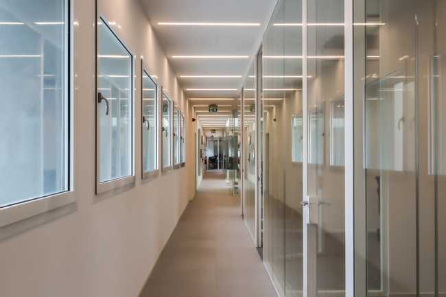 The corridor with the glass offices