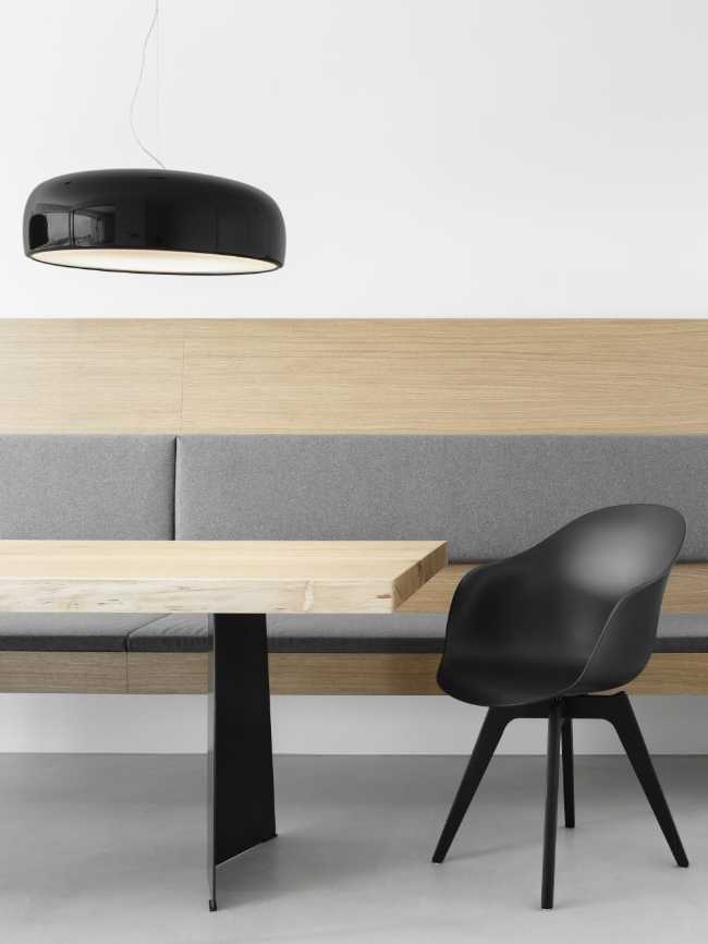 In the dining area the furnishings are in wood with black details