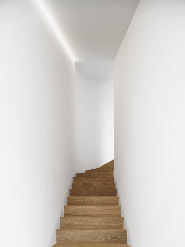 The wooden cladding of the staircase