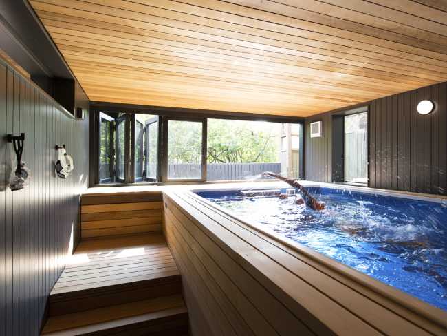 hydromassage tub with wood covering