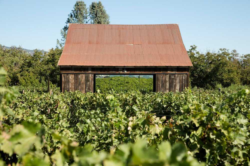 The exterior of the restored wooden barn