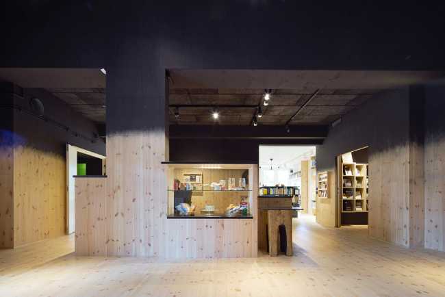 The interior rooms with wooden floors and walls