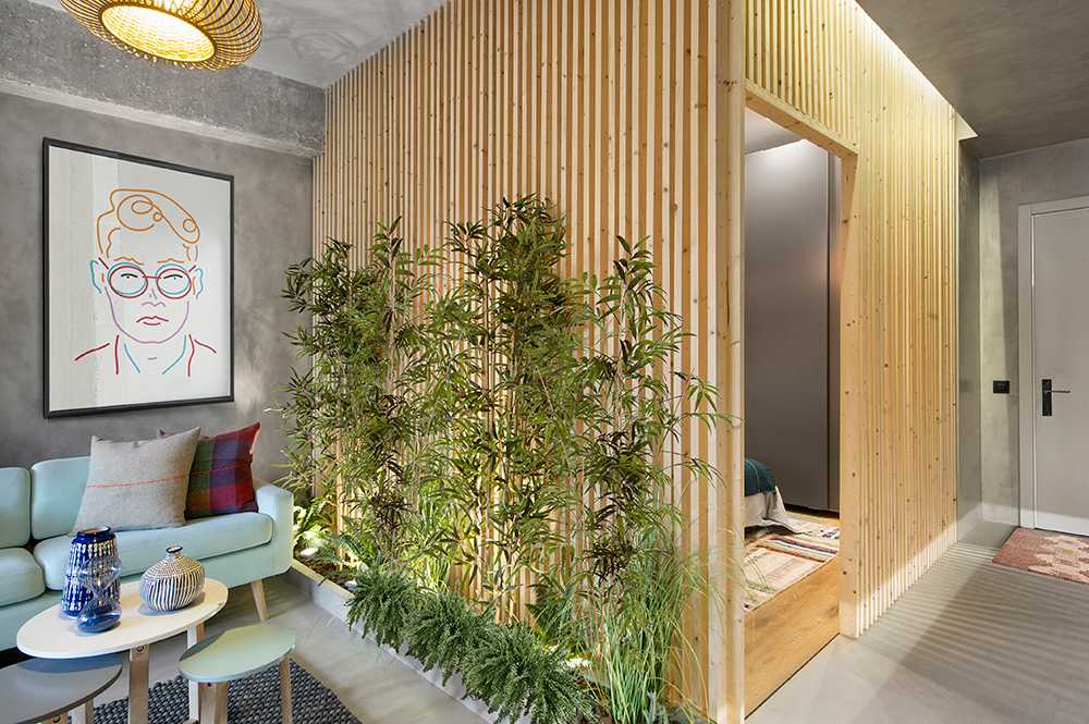 A wooden cube wraps around the bedroom