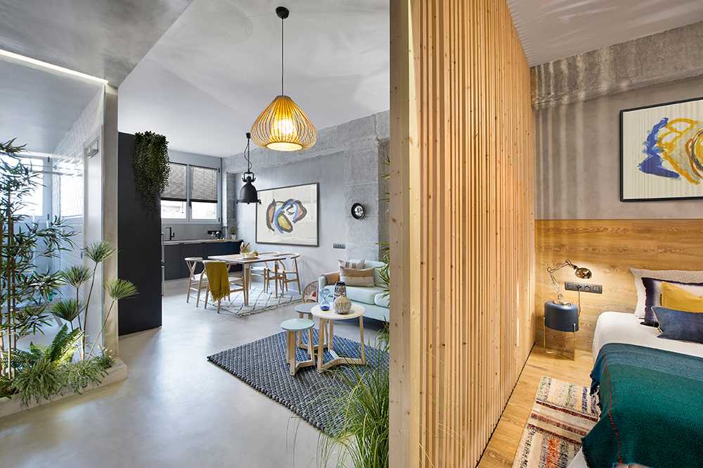 A wooden cube wraps around the bedroom