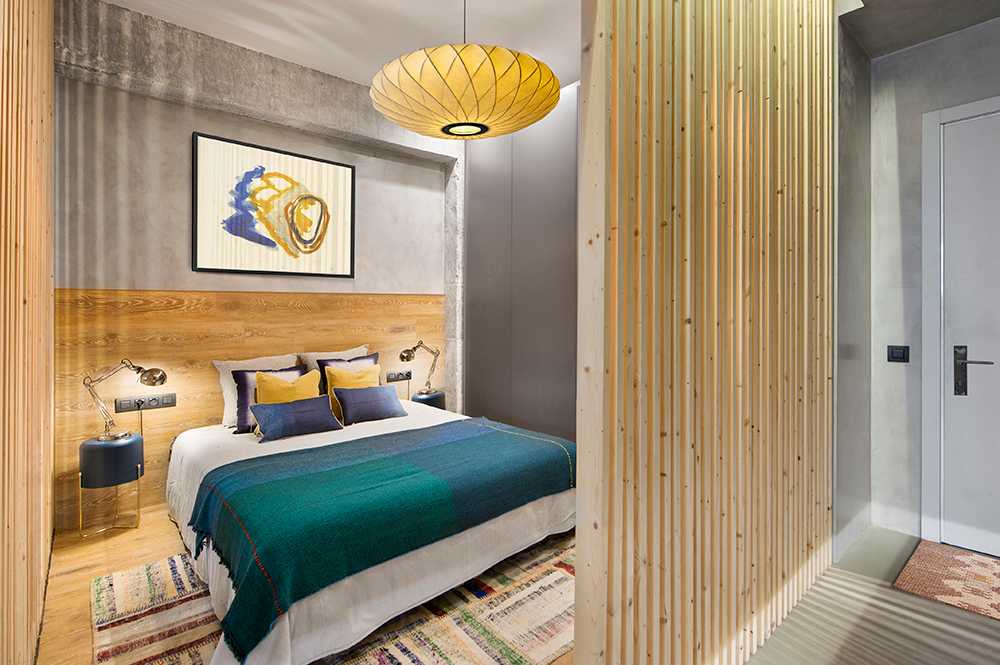A wooden cube wraps around the bedroom