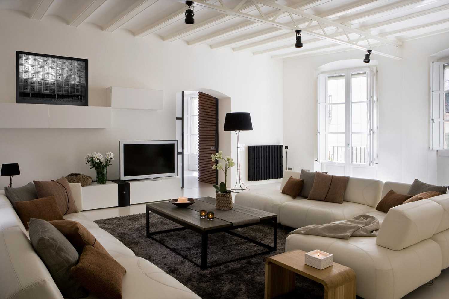 The light-colored living area and the completely white ceiling