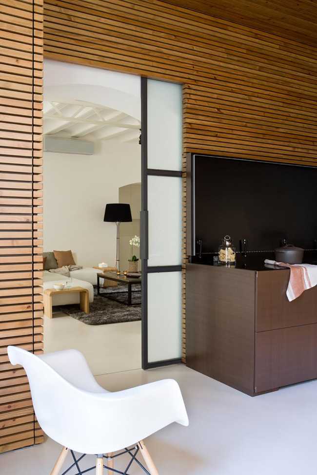 The seats are modern but with wooden details like the wall covering