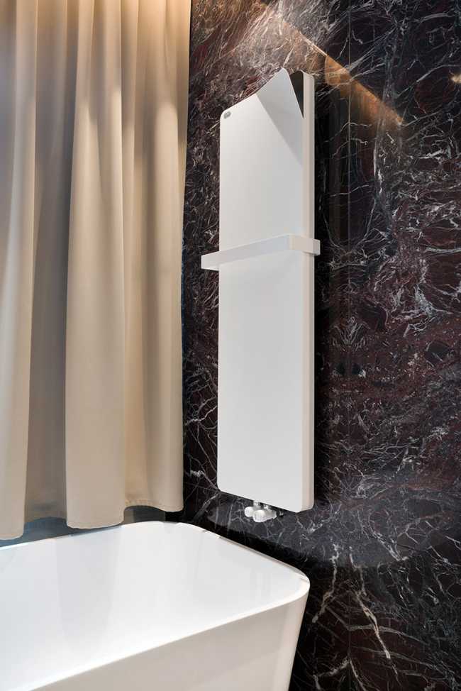 heated towel rail and bathtub for a hotel