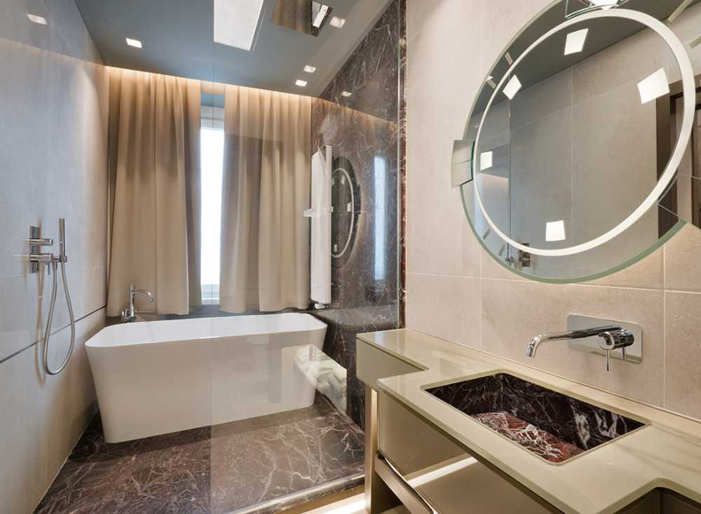 bathroom with full glass tub