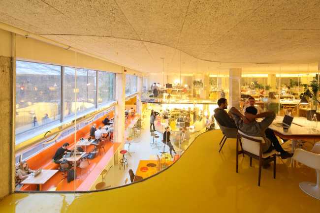 The offices on the floor with floor to ceiling windows