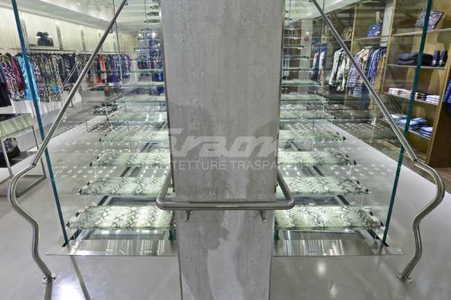 Detail of the stainless steel handrail that coordinates with the shop furnishings