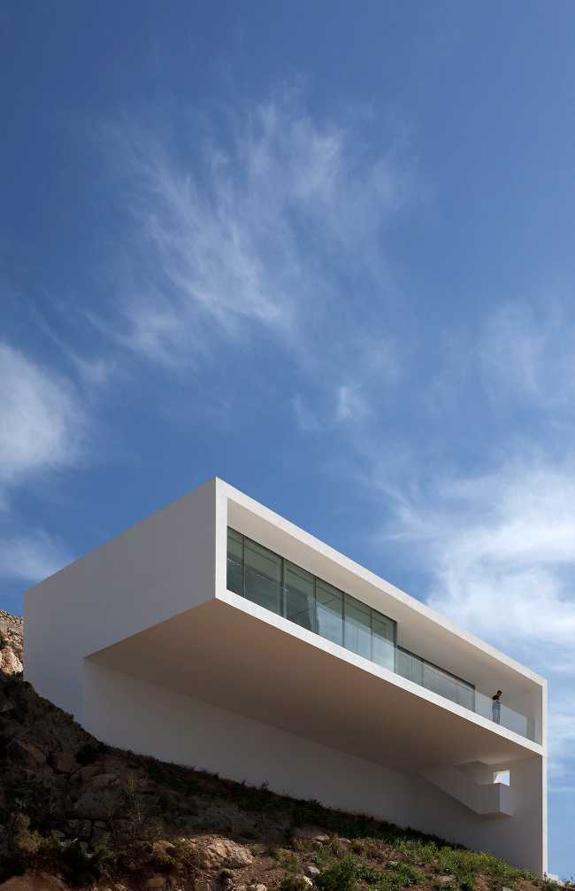 White villa suspended on the sea