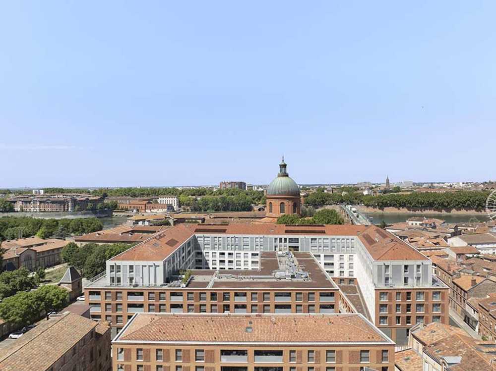 Cour du Dôme: edificio multifunzionale contemporaneo abbraccia la storia