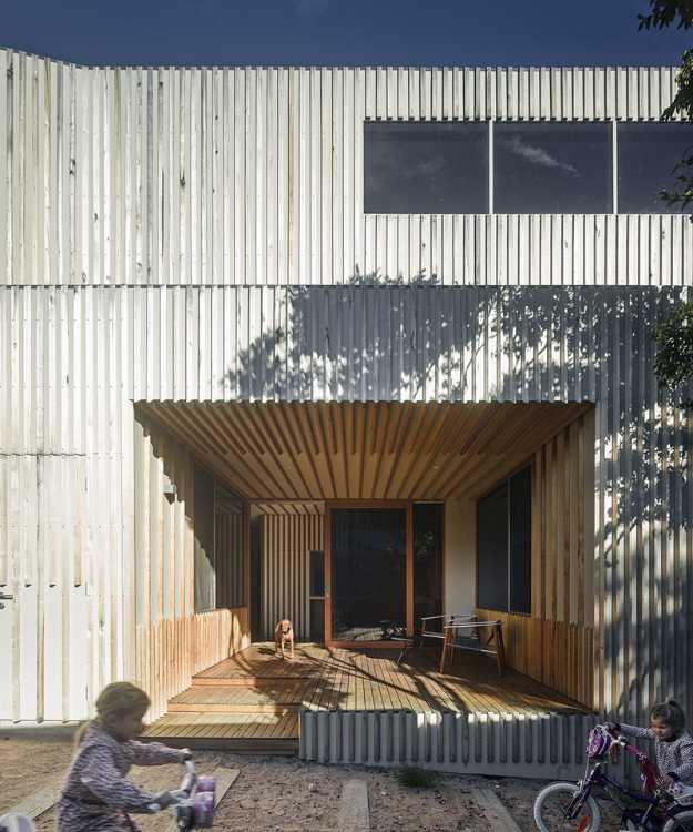 Wooden dwelling vertical slats