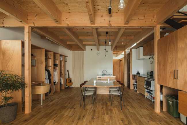 Ceiling, floor and wooden furniture with white walls