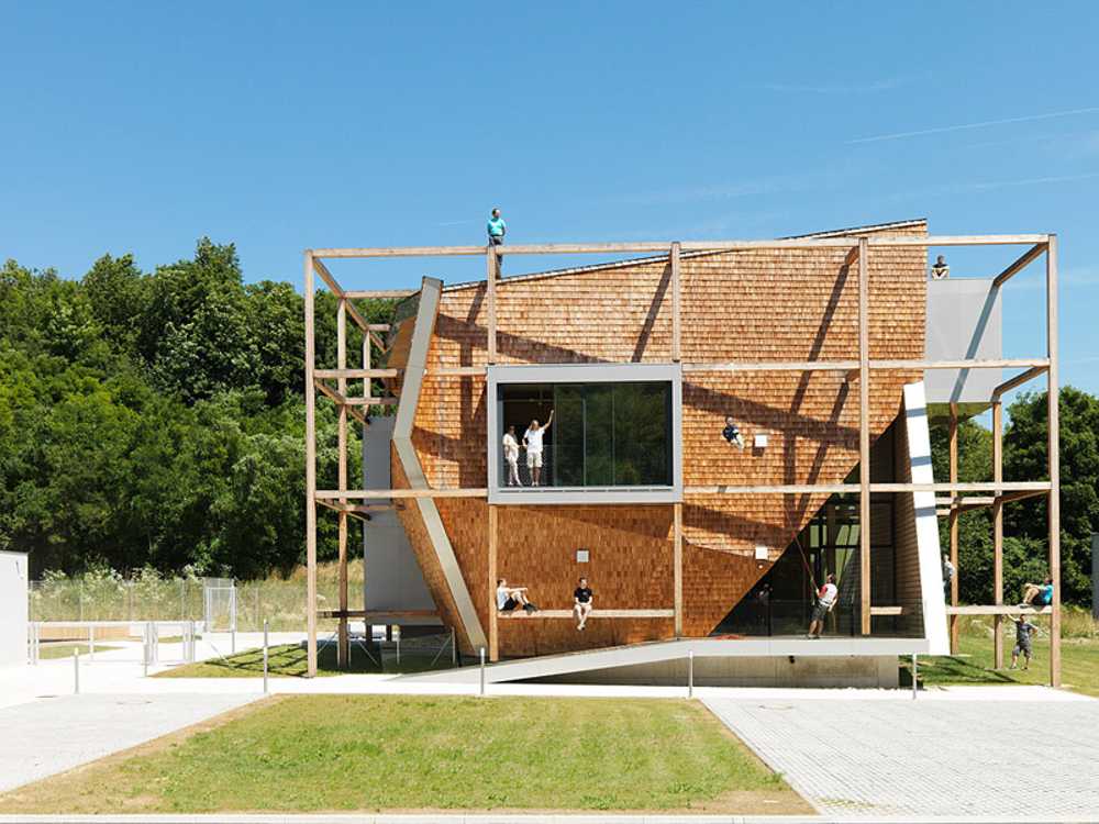 Larch office building exterior, with Canadian pine roof and prefabricated panels