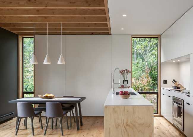 White and wood kitchen and dining room