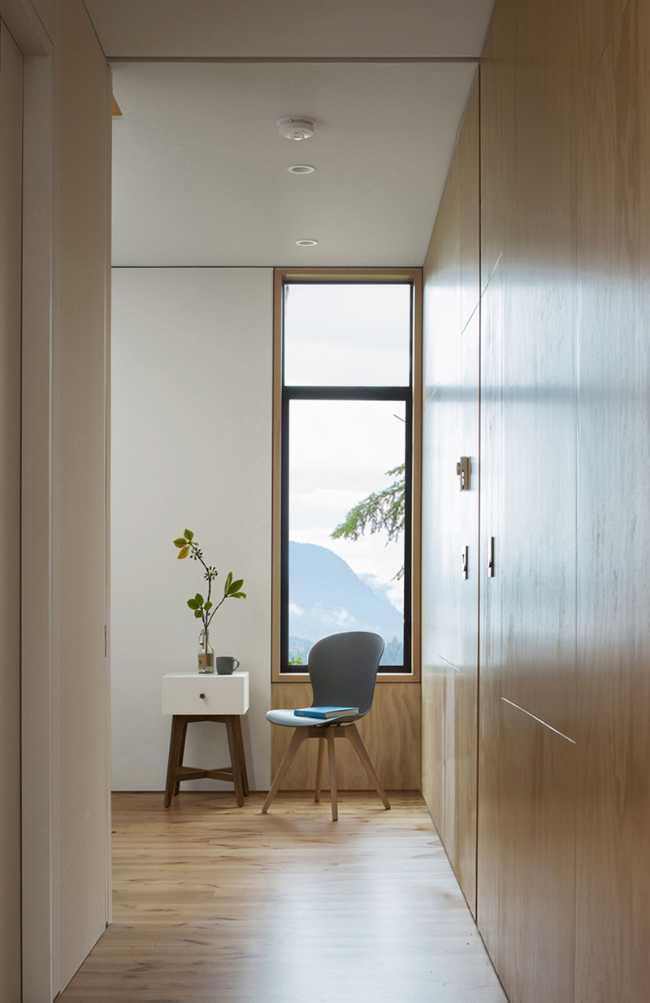 White interior and wood and vertical window