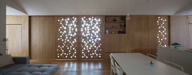 Parete esterna in legno traforata