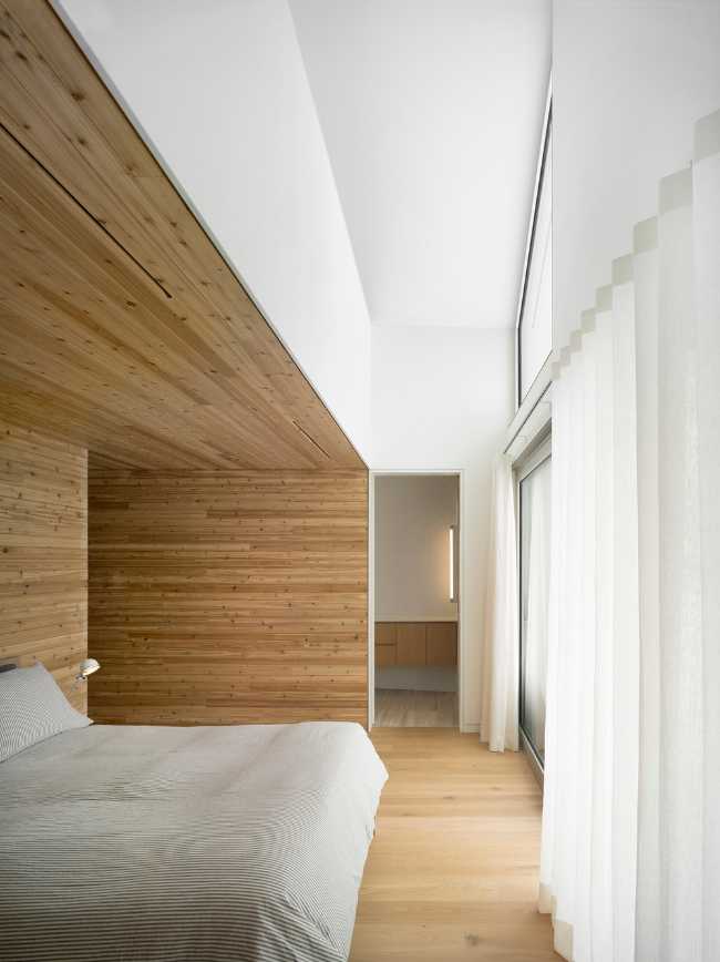 Camera da letto in intonaco e legno