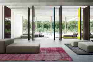Colored wall of Fritsjurgens doors with retractable hinges rotating on a vertical axis