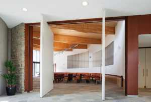 Wooden wall of Fritsjurgens doors with retractable hinge rotation on vertical axis