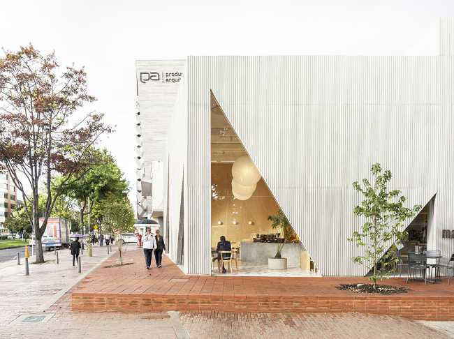 white volume and triangular glass openings