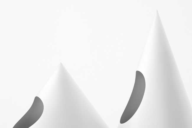 Tables that recall triangular curtains