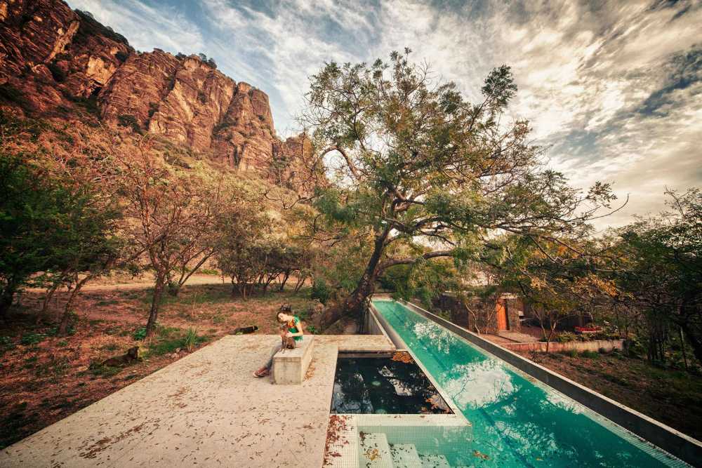Swimming pool between rocks and nature