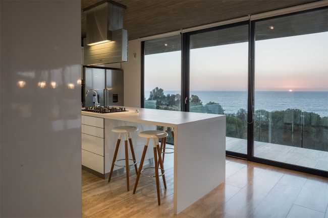 Concrete villa with glass balustrade