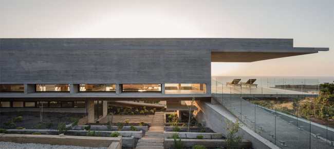 Concrete villa with glass balustrade