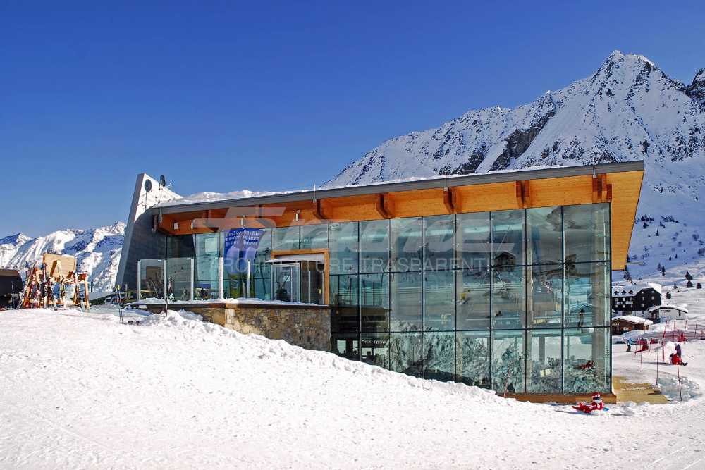 Wooden, glass, stone and metal shelter