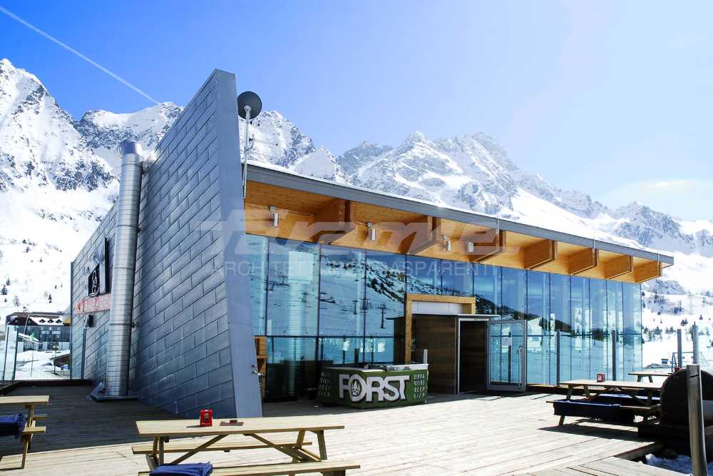 Wooden, glass, stone and metal shelter