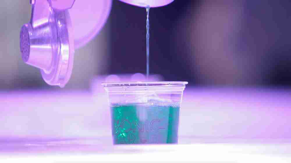 Robot barman colored bottles