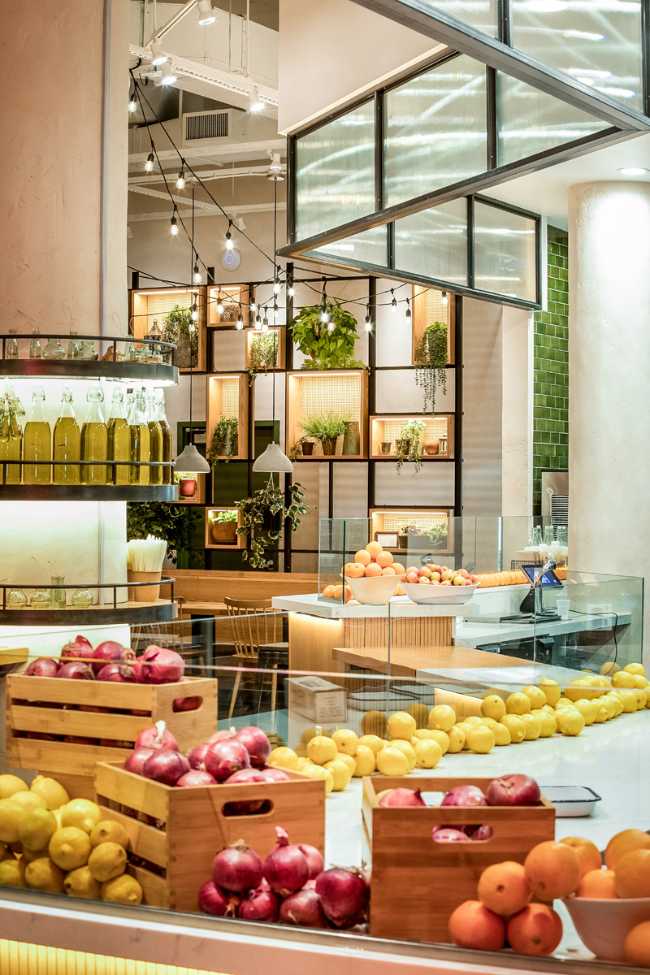 Restaurant counter with fresh fruit and vegetables