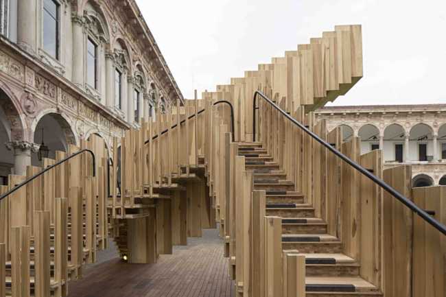 Installation of a wooden staircase in a historic internal courtyard