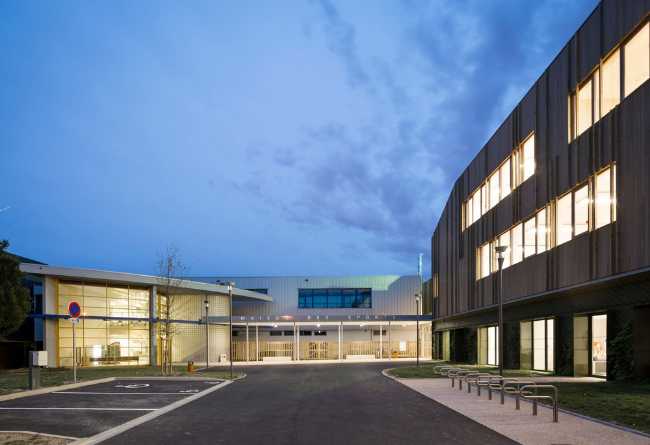 Sports center illuminated at night