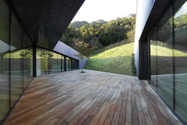Glass walls of a wooden villa