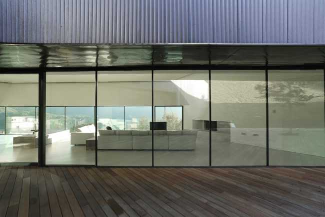 Glass walls of a wooden villa