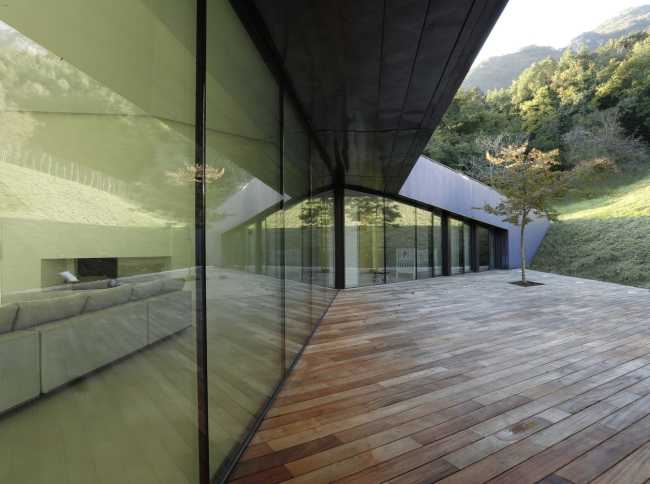 Glass walls of a wooden villa