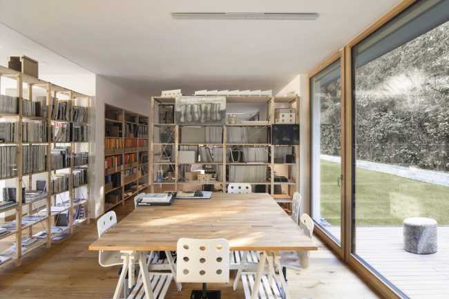 internal wooden bookcase and stained glass window