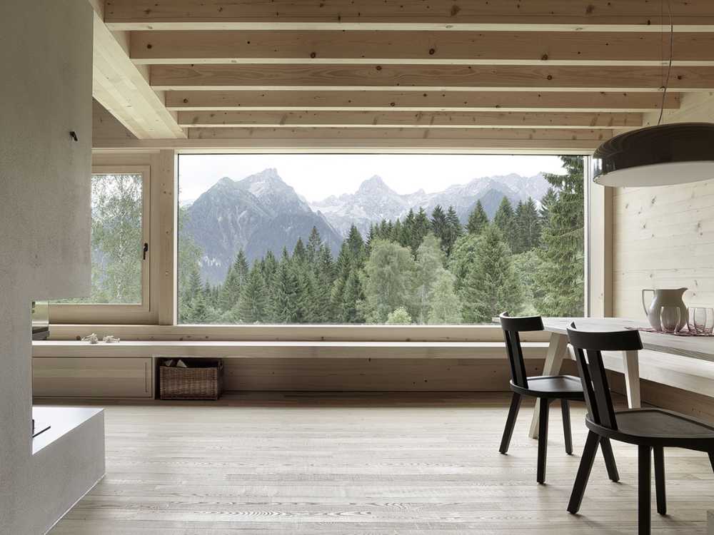 Wooden house with window on the panorama