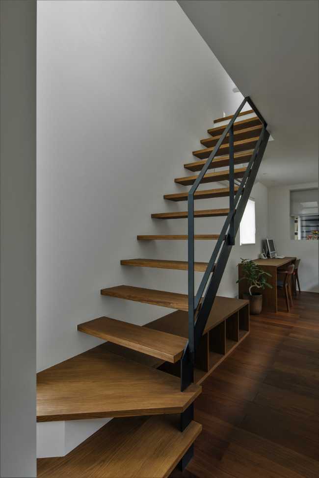 Internal wooden staircase and metal balustrade